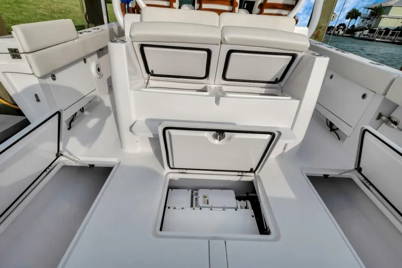 Aqua Toy Yacht Photos Pics 2023 Jupiter 43 Center Console boat with open storage compartments and seating.