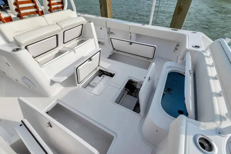 Aqua Toy Yacht Photos Pics 2023 Jupiter 43 Center Console boat with open storage compartments and seating area.