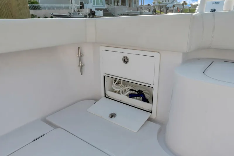 Aqua Toy Yacht Photos Pics 2023 Jupiter 43 Center Console boat storage compartment with white interior.