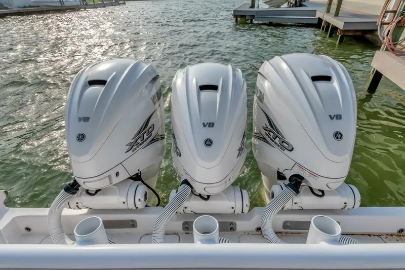 Aqua Toy Yacht Photos Pics Triple outboard engines on a 2023 Jupiter 43 Center Console boat.