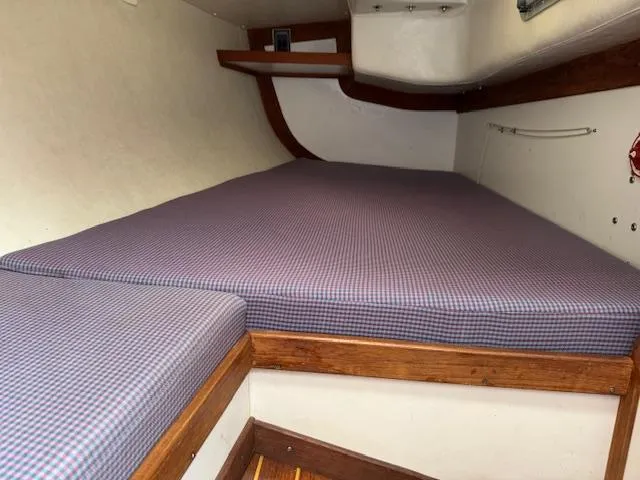  Yacht Photos Pics Cozy cabin interior of 1996 J Boats J/120 with checkered bedding.
