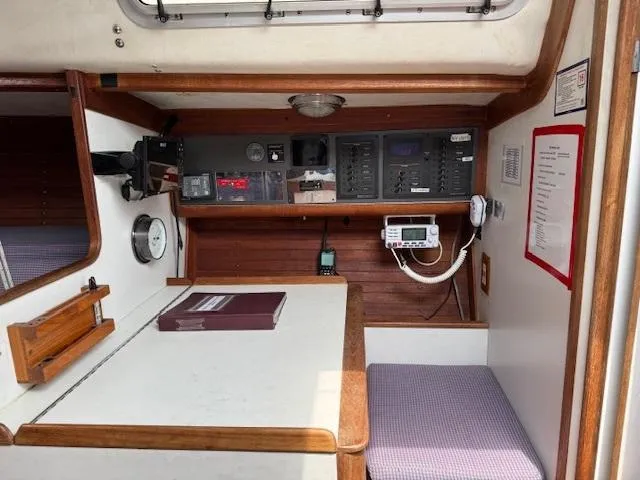  Yacht Photos Pics 1996 J Boats J/120 interior with navigation equipment and seating area.