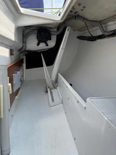  Yacht Photos Pics Interior view of a 1996 J Boats J/120 sailboat, showing storage and mechanical components.