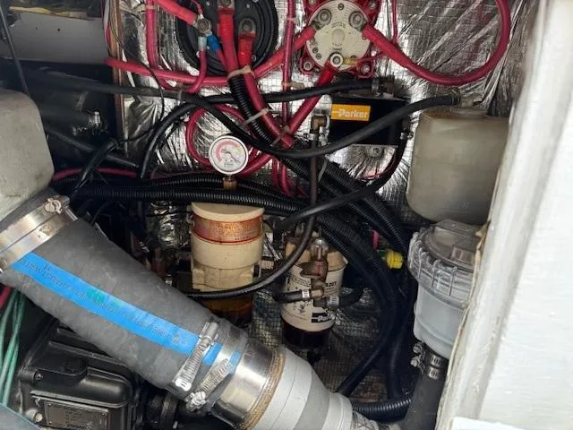  Yacht Photos Pics Engine compartment of a 1996 J Boats J/120, featuring hoses and mechanical components.