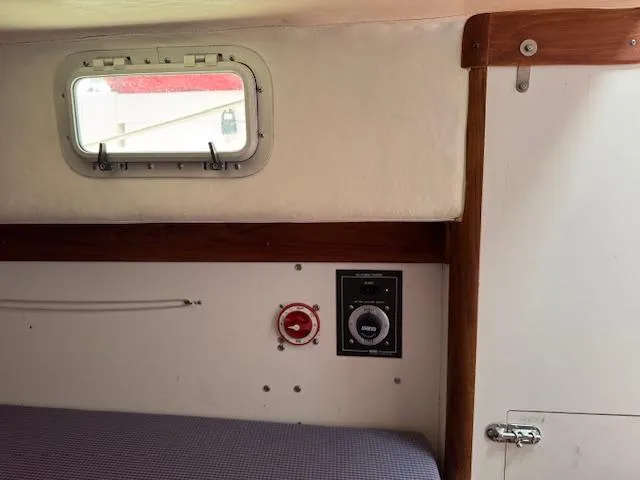  Yacht Photos Pics Interior of a 1996 J Boats J/120, featuring a cabin window and control panel.