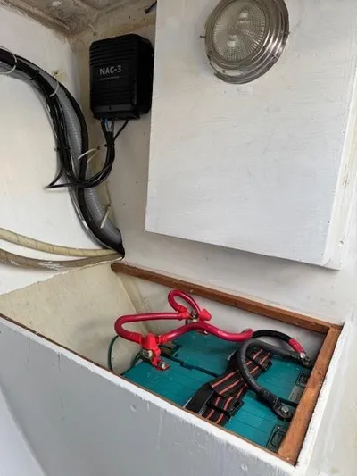  Yacht Photos Pics Battery compartment of a 1996 J Boats J/120 sailboat, featuring wiring and a NAC-3 unit.