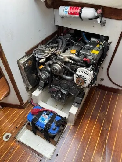  Yacht Photos Pics Engine compartment of a 1996 J Boats J/120 sailboat with visible engine and battery.
