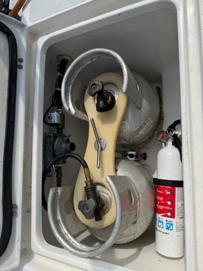  Yacht Photos Pics Propane storage compartment on a 1996 J Boats J/120 with fire extinguisher.