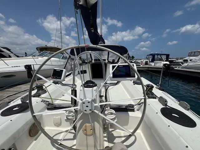  Yacht Photos Pics Cockpit view of a 1996 J Boats J/120 sailboat docked at a marina.