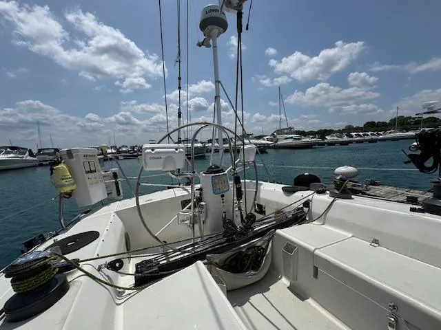  Yacht Photos Pics Sailboat cockpit of 1996 J Boats J/120, docked with clear skies and marina view.