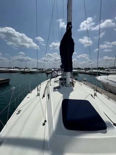  Yacht Photos Pics Sailboat deck view of 1996 J Boats J/120 in marina under blue sky.