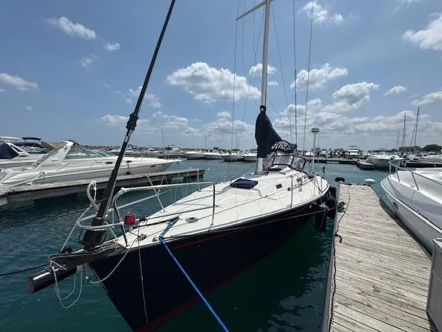  Yacht Photos Pics 1996 J Boats J/120 sailboat docked at marina under blue sky.