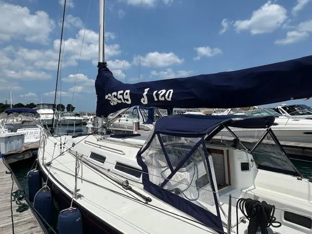  Yacht Photos Pics 1996 J Boats J/120 sailboat docked at marina under blue sky.