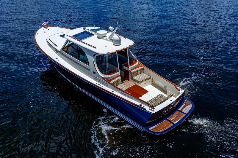 Norora Yacht Photos Pics 2016 Hinckley Picnic Boat 37 MKIII cruising on open water, showcasing elegant design.