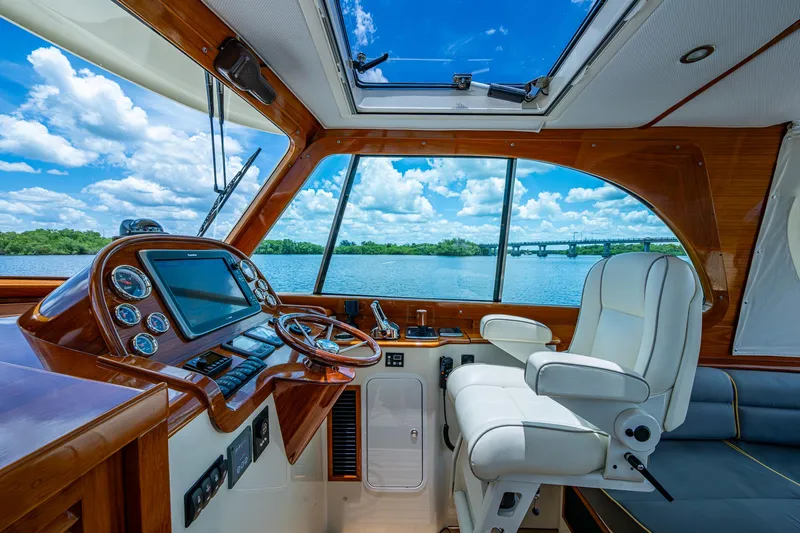 Norora Yacht Photos Pics Interior of 2016 Hinckley Picnic Boat 37 MKIII with luxurious helm and scenic view.