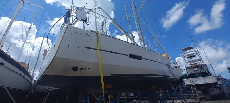 Pelican Yacht Photos Pics 2020 Dufour 460 Grand Large sailboat on dry dock under a blue sky.