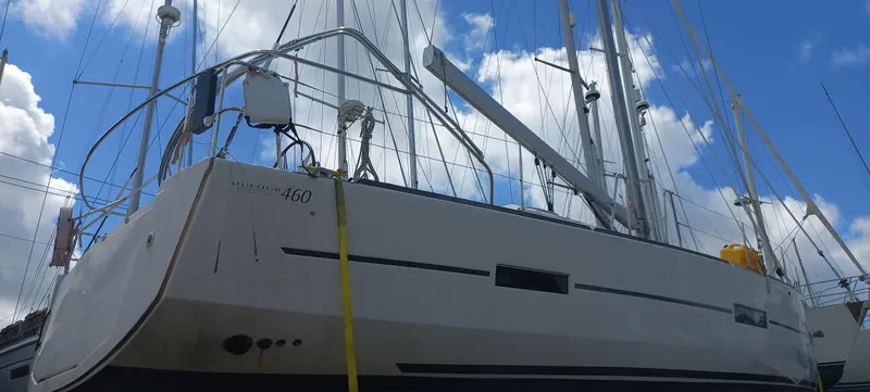 Pelican Yacht Photos Pics Dufour 460 Grand Large 2020 sailboat against a cloudy sky background.