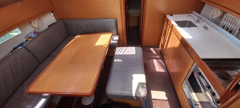 Pelican Yacht Photos Pics Interior of 2020 Dufour 460 Grand Large yacht with dining area and kitchen.