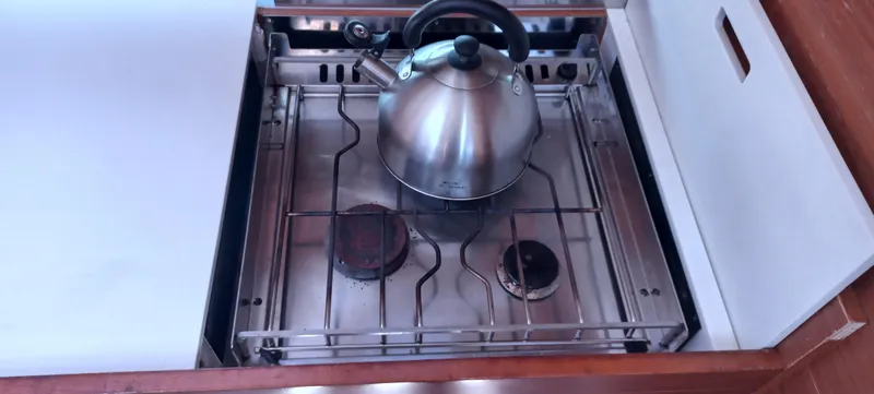 Pelican Yacht Photos Pics Stainless steel kettle on a stove in a 2020 Dufour 460 Grand Large yacht kitchen.