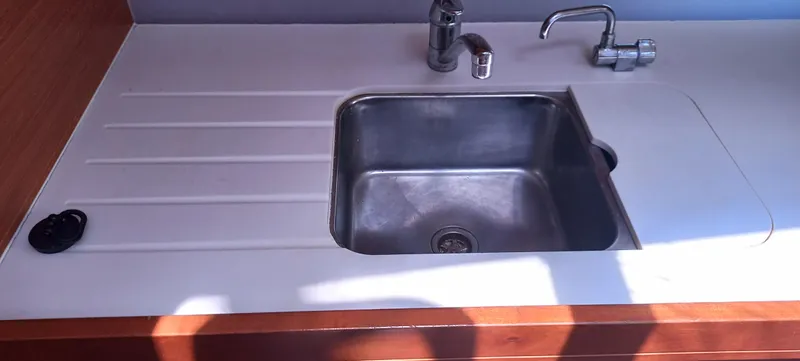 Pelican Yacht Photos Pics Modern kitchen sink on 2020 Dufour 460 Grand Large yacht, featuring sleek design and functionality.