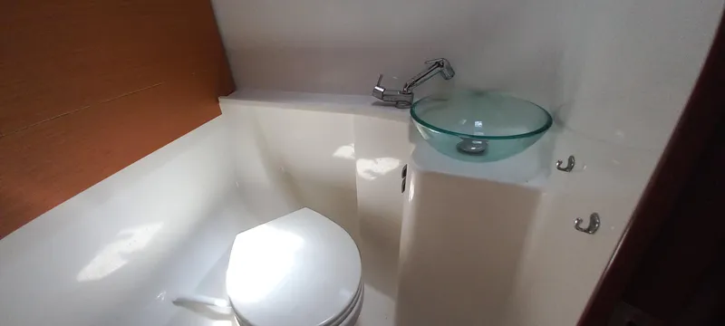 Pelican Yacht Photos Pics Bathroom interior of 2020 Dufour 460 Grand Large yacht with modern sink and toilet.