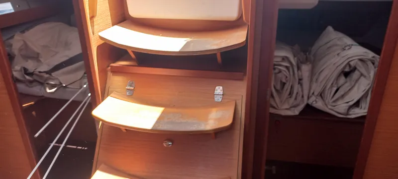 Pelican Yacht Photos Pics Interior of 2020 Dufour 460 Grand Large yacht with wooden steps and storage.