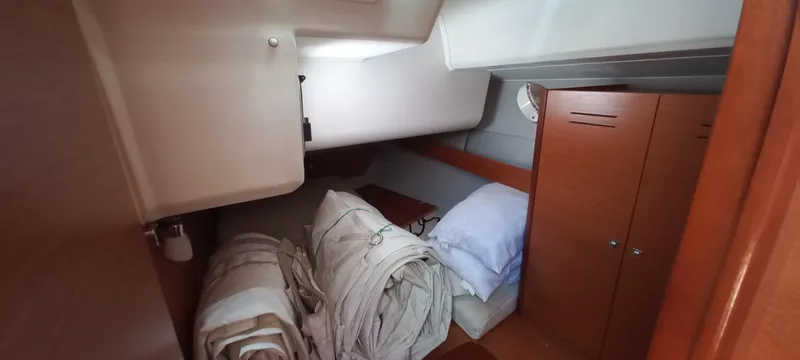Pelican Yacht Photos Pics Cabin interior of 2020 Dufour 460 Grand Large yacht with bedding and storage.