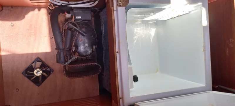 Pelican Yacht Photos Pics Dufour 460 Grand Large 2020 yacht interior showing refrigerator and compressor unit.