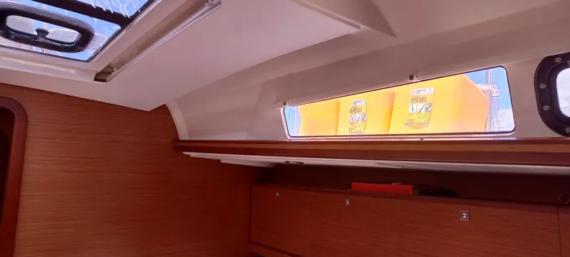 Pelican Yacht Photos Pics Interior of 2020 Dufour 460 Grand Large yacht with wooden cabinetry and skylight.