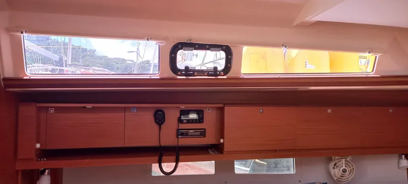 Pelican Yacht Photos Pics Interior view of 2020 Dufour 460 Grand Large yacht with wooden cabinetry and windows.
