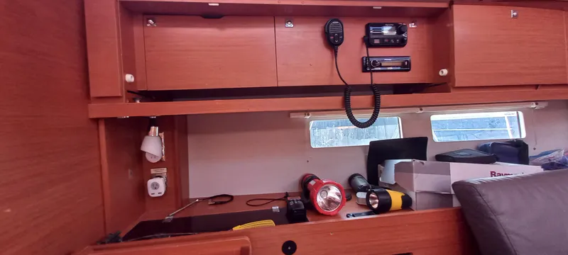 Pelican Yacht Photos Pics Interior of 2020 Dufour 460 Grand Large yacht with storage, radio, and flashlights.