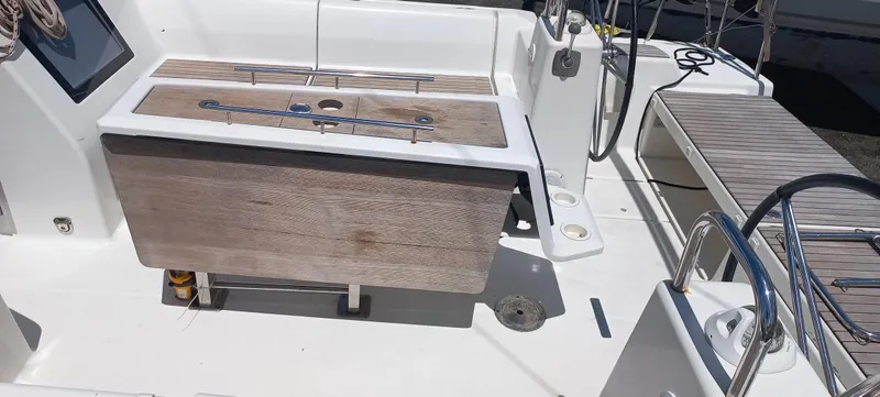 Pelican Yacht Photos Pics 2020 Dufour 460 Grand Large yacht cockpit with wooden table and seating area.