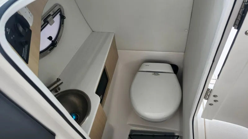  Yacht Photos Pics 2025 Regal LX6 boat interior bathroom with sink and toilet.