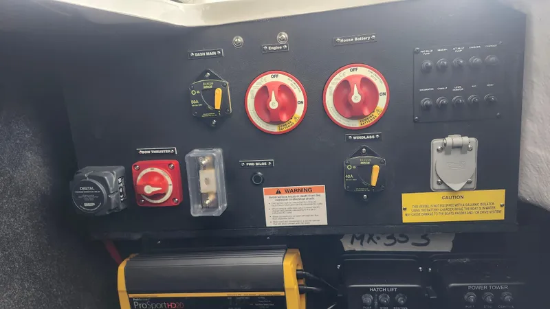  Yacht Photos Pics Control panel of a 2025 Regal LX6 boat with various switches and gauges.