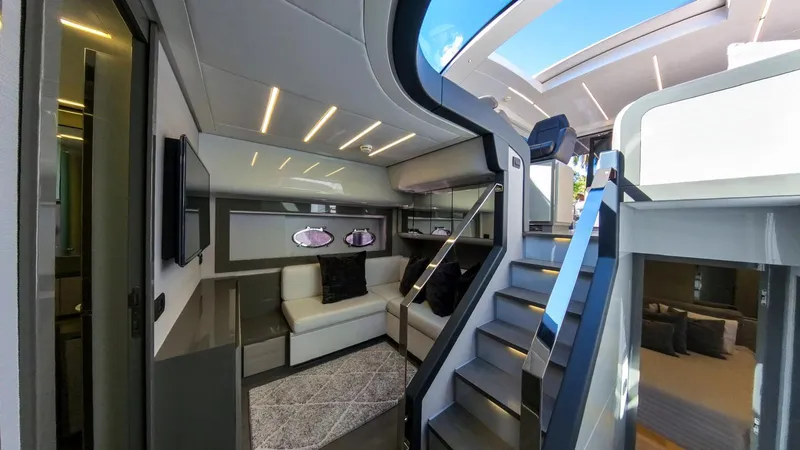 Finstar Yacht Photos Pics Luxurious interior of a 2014 Pershing 62 yacht with modern design and elegant furnishings.