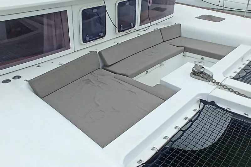 Kala Yacht Photos Pics 2016 Lagoon 450 F catamaran with cushioned seating and netted deck area.