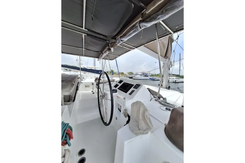 Kala Yacht Photos Pics 2016 Lagoon 450 F yacht cockpit with steering wheel and navigation controls.