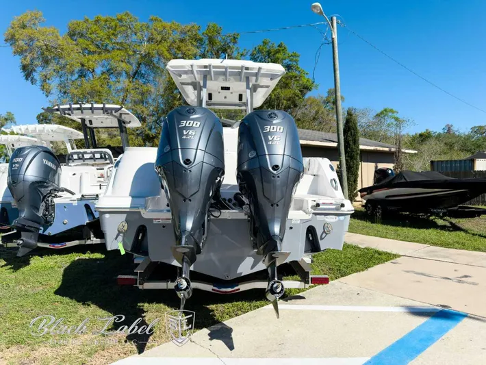 Your Next Boat! Yacht Photos Pics 2025 Sea Fox 288 Commander with twin Yamaha 300 V6 engines, parked outdoors.