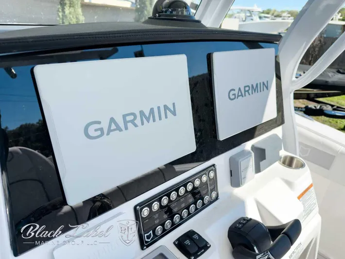 Your Next Boat! Yacht Photos Pics 2025 Sea Fox 288 Commander dashboard with dual Garmin displays and control panel.