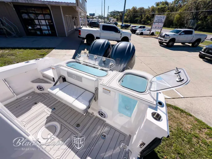 Your Next Boat! Yacht Photos Pics 2025 Sea Fox 288 Commander boat interior with seating and storage, displayed outdoors.