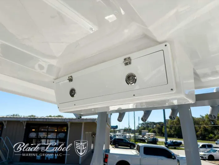 Your Next Boat! Yacht Photos Pics 2025 Sea Fox 288 Commander boat storage compartment, Black Label Marine Group branding.
