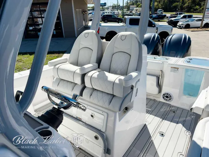 Your Next Boat! Yacht Photos Pics 2025 Sea Fox 288 Commander boat interior with dual captain's chairs and steering wheel.