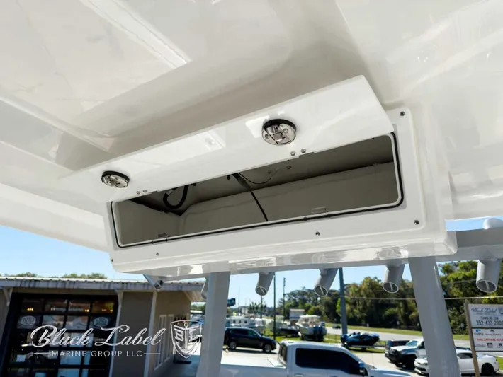 Your Next Boat! Yacht Photos Pics 2025 Sea Fox 288 Commander storage compartment with open hatch, showcasing interior space.