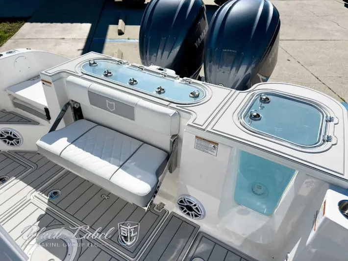 Your Next Boat! Yacht Photos Pics 2025 Sea Fox 288 Commander boat interior with seating and dual Yamaha engines.