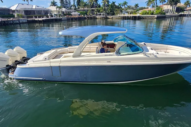  Yacht Photos Pics 2021 Chris-Craft Launch 35 GT OB boat cruising on calm waters.