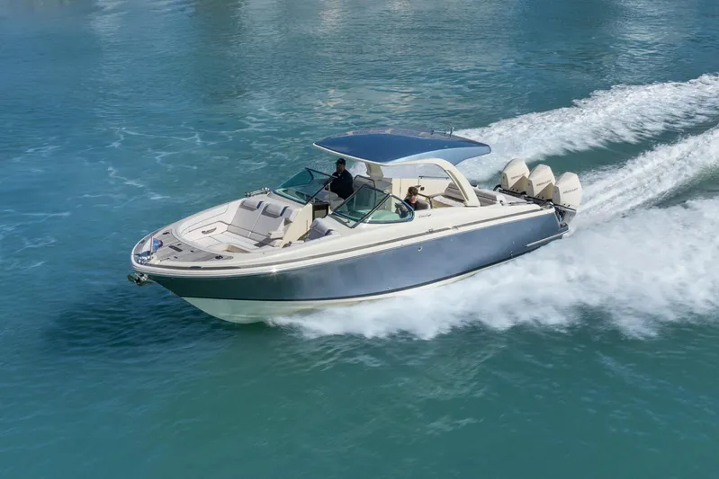  Yacht Photos Pics 2021 Chris-Craft Launch 35 GT OB cruising on clear blue water.