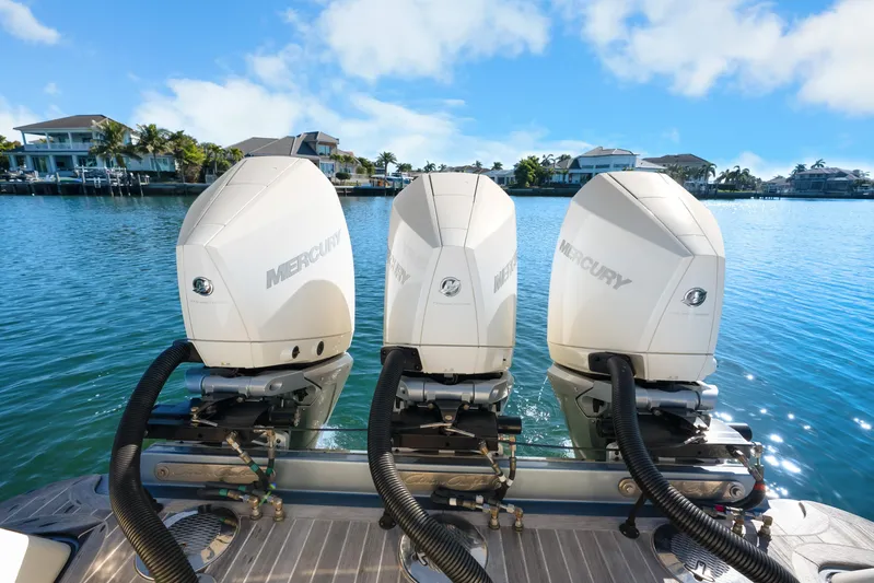  Yacht Photos Pics Triple Mercury outboard engines on 2021 Chris-Craft Launch 35 GT OB, docked in scenic marina.