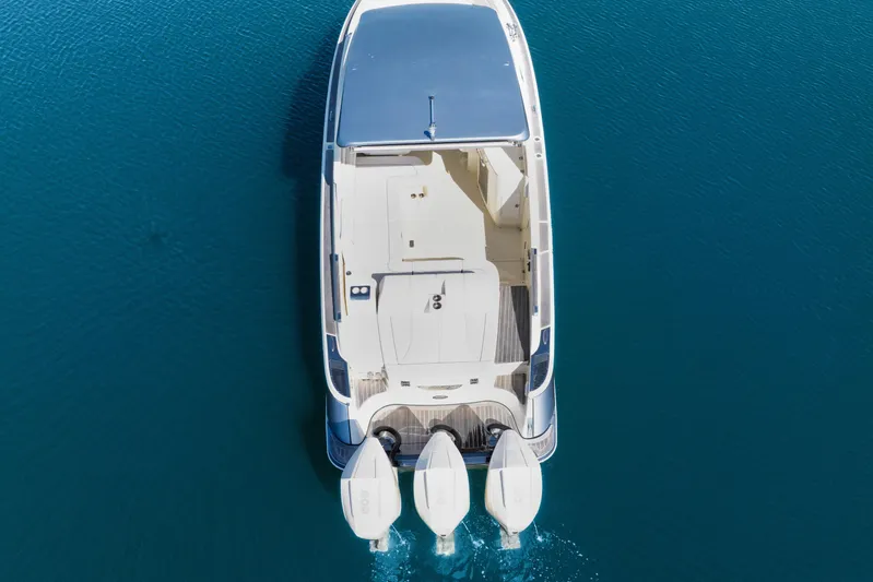  Yacht Photos Pics Overhead view of 2021 Chris-Craft Launch 35 GT OB on clear blue water.