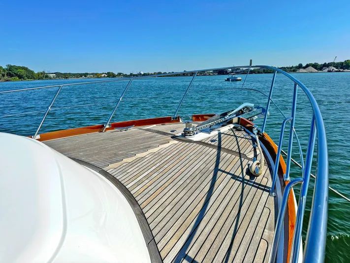 Phoenix Yacht Photos Pics 2014 Grand Banks 46 Eastbay FB yacht deck overlooking serene waters.