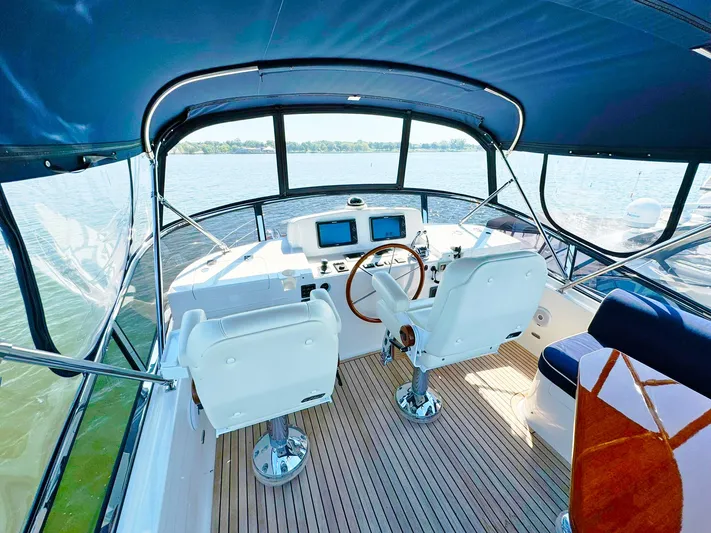 Phoenix Yacht Photos Pics Flybridge of 2014 Grand Banks 46 Eastbay FB yacht with dual helm seats and navigation equipment.